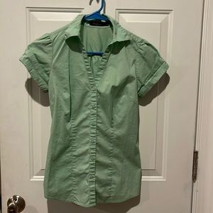 The limited essential sz xs light green shirt.  V neck and cuffed short sleeves.